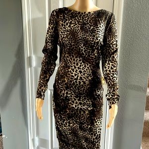 Leopard print pencil dress. Polyester stretch material. Has black lining.